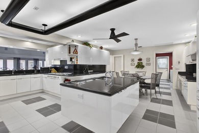 Set on 1.25 acres directly across from PGA National, this estate on  in Florida - for sale on GolfHomes.com, golf home, golf lot