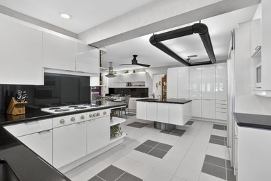 Set on 1.25 acres directly across from PGA National, this estate on  in Florida - for sale on GolfHomes.com, golf home, golf lot