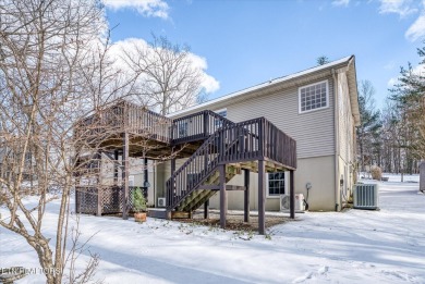 Nestled in the heart of Fairfield Glade North, this 2006-built on Heatherhurst Golf Course in Tennessee - for sale on GolfHomes.com, golf home, golf lot