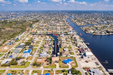 Welcome to paradise in Southwest Cape Coral! This luxurious on Royal Tee Country Club in Florida - for sale on GolfHomes.com, golf home, golf lot