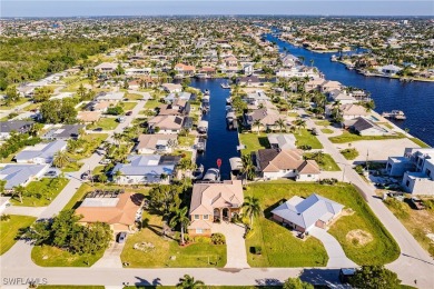 Welcome to paradise in Southwest Cape Coral! This luxurious on Royal Tee Country Club in Florida - for sale on GolfHomes.com, golf home, golf lot