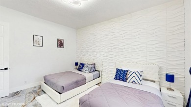 This lovely home, redesigned to be a peaceful retreat, is just a on The Wanderers Club in Florida - for sale on GolfHomes.com, golf home, golf lot