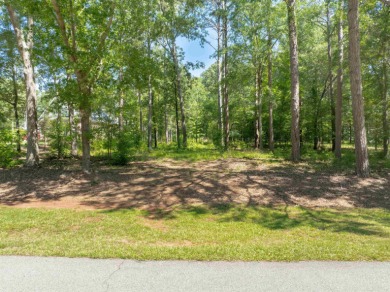 Set along the tranquil 12th green of the prestigious Jack on Great Waters Course At Reynolds Plantation in Georgia - for sale on GolfHomes.com, golf home, golf lot