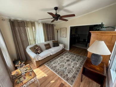 This well-cared for 2-bedroom, 2-bathroom home is being sold on Del Tura Golf and Country Club in Florida - for sale on GolfHomes.com, golf home, golf lot