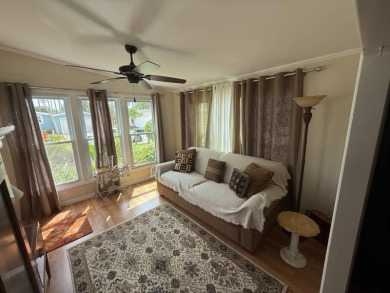 This well-cared for 2-bedroom, 2-bathroom home is being sold on Del Tura Golf and Country Club in Florida - for sale on GolfHomes.com, golf home, golf lot
