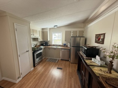 This well-cared for 2-bedroom, 2-bathroom home is being sold on Del Tura Golf and Country Club in Florida - for sale on GolfHomes.com, golf home, golf lot