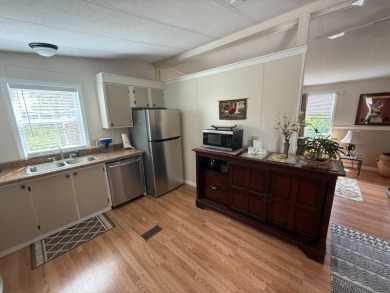 This well-cared for 2-bedroom, 2-bathroom home is being sold on Del Tura Golf and Country Club in Florida - for sale on GolfHomes.com, golf home, golf lot