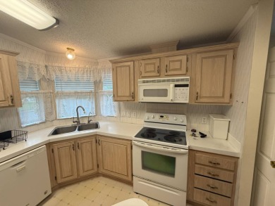 This well loved 2-bedroom, 2-bathroom Palm Harbor home is being on Del Tura Golf and Country Club in Florida - for sale on GolfHomes.com, golf home, golf lot