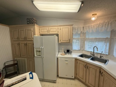This well loved 2-bedroom, 2-bathroom Palm Harbor home is being on Del Tura Golf and Country Club in Florida - for sale on GolfHomes.com, golf home, golf lot