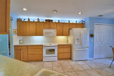 Under contract-accepting backup offers. TEE TIME? YES! The green on Lake Bess Golf Club in Florida - for sale on GolfHomes.com, golf home, golf lot