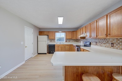 Coastal Living on the Golf Course! Nestled in the highly on Beau Rivage Golf and Resort in North Carolina - for sale on GolfHomes.com, golf home, golf lot