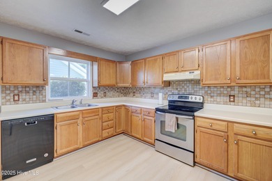 Coastal Living on the Golf Course! Nestled in the highly on Beau Rivage Golf and Resort in North Carolina - for sale on GolfHomes.com, golf home, golf lot