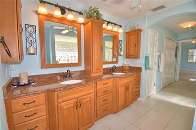 Under contract-accepting backup offers. TEE TIME? YES! The green on Lake Bess Golf Club in Florida - for sale on GolfHomes.com, golf home, golf lot