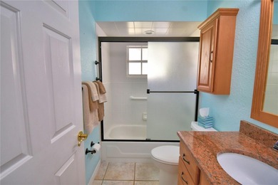 Under contract-accepting backup offers. TEE TIME? YES! The green on Lake Bess Golf Club in Florida - for sale on GolfHomes.com, golf home, golf lot