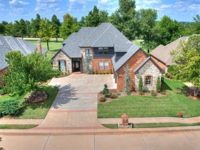 ENJOY THE VIEW OF THE GOLF COURSE FROM THE FIFTEENTH FAIRWAY! on Oak Tree National Golf and Country Club in Oklahoma - for sale on GolfHomes.com, golf home, golf lot