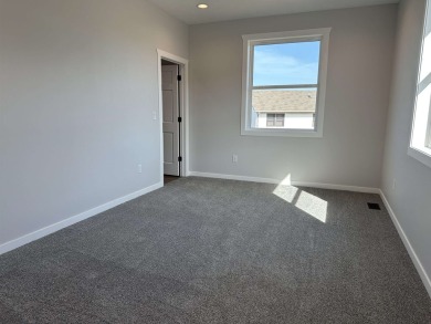 Let's take a look at this new build in Akron, Iowa. This on Akron Golf Course in Iowa - for sale on GolfHomes.com, golf home, golf lot
