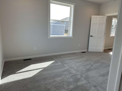 Let's take a look at this new build in Akron, Iowa. This on Akron Golf Course in Iowa - for sale on GolfHomes.com, golf home, golf lot