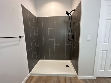Let's take a look at this new build in Akron, Iowa. This on Akron Golf Course in Iowa - for sale on GolfHomes.com, golf home, golf lot