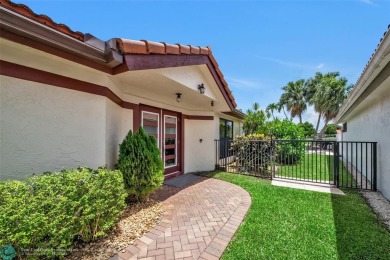 Charming 2-bedroom, 2-bath single-family home offers an array of on Boca Woods Country Club in Florida - for sale on GolfHomes.com, golf home, golf lot