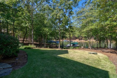 Lakefront retreat o Sunset views o Two outdoor kitchens o Steps on Reynolds Lake Oconee - The Oconee in Georgia - for sale on GolfHomes.com, golf home, golf lot