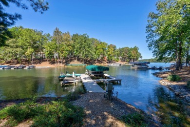 Lakefront retreat o Sunset views o Two outdoor kitchens o Steps on Reynolds Lake Oconee - The Oconee in Georgia - for sale on GolfHomes.com, golf home, golf lot