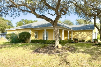 Welcome to this spacious Heron's Roost retreat under the trees! on Rockport Country Club in Texas - for sale on GolfHomes.com, golf home, golf lot