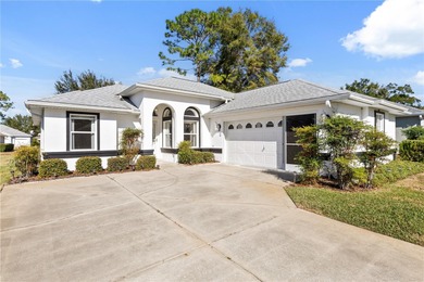 Discover the perfect blend of charm, comfort, and resort-style on Royal Oaks Golf Club in Florida - for sale on GolfHomes.com, golf home, golf lot
