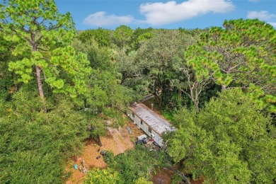 This expansive 3.68-acre property is a rare find in one of on Mayfair Country Club in Florida - for sale on GolfHomes.com, golf home, golf lot