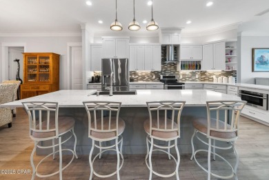 CUSTOM LAKE FRONT HOME WITH PRIVATE DOCK, BOATHOUSE FEATURING 6K on Sharks Tooth Golf Club in Florida - for sale on GolfHomes.com, golf home, golf lot