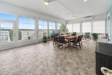 CUSTOM LAKE FRONT HOME WITH PRIVATE DOCK, BOATHOUSE FEATURING 6K on Sharks Tooth Golf Club in Florida - for sale on GolfHomes.com, golf home, golf lot