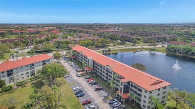 Spacious Magnolia corner unit with a lake view at Century on Flamingo Lakes Country Club in Florida - for sale on GolfHomes.com, golf home, golf lot