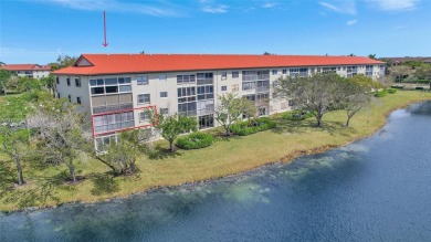 Spacious Magnolia corner unit with a lake view at Century on Flamingo Lakes Country Club in Florida - for sale on GolfHomes.com, golf home, golf lot