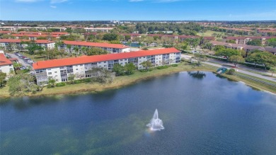 Spacious Magnolia corner unit with a lake view at Century on Flamingo Lakes Country Club in Florida - for sale on GolfHomes.com, golf home, golf lot