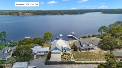 CUSTOM LAKE FRONT HOME WITH PRIVATE DOCK, BOATHOUSE FEATURING 6K on Sharks Tooth Golf Club in Florida - for sale on GolfHomes.com, golf home, golf lot
