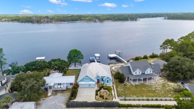 CUSTOM LAKE FRONT HOME WITH PRIVATE DOCK, BOATHOUSE FEATURING 6K on Sharks Tooth Golf Club in Florida - for sale on GolfHomes.com, golf home, golf lot