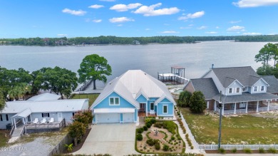 CUSTOM LAKE FRONT HOME WITH PRIVATE DOCK, BOATHOUSE FEATURING 6K on Sharks Tooth Golf Club in Florida - for sale on GolfHomes.com, golf home, golf lot