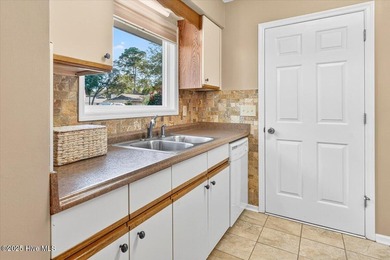 Discover this pristine 3-bedroom, 2-bath home located in the on Sea Trail Golf Resort in North Carolina - for sale on GolfHomes.com, golf home, golf lot
