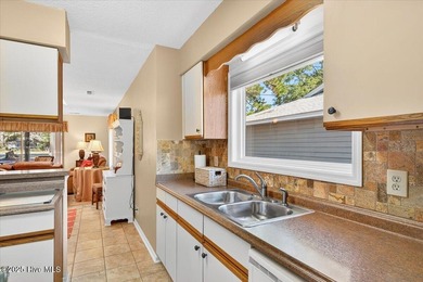 Discover this pristine 3-bedroom, 2-bath home located in the on Sea Trail Golf Resort in North Carolina - for sale on GolfHomes.com, golf home, golf lot