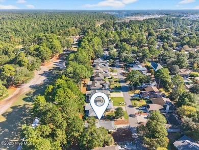 Discover this pristine 3-bedroom, 2-bath home located in the on Sea Trail Golf Resort in North Carolina - for sale on GolfHomes.com, golf home, golf lot