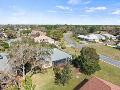 Situated on a large .34 corner lot, this beautifully landscaped on Glen Lakes Country Club in Florida - for sale on GolfHomes.com, golf home, golf lot