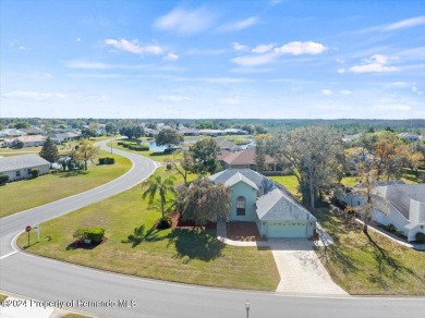 Situated on a large .34 corner lot, this beautifully landscaped on Glen Lakes Country Club in Florida - for sale on GolfHomes.com, golf home, golf lot