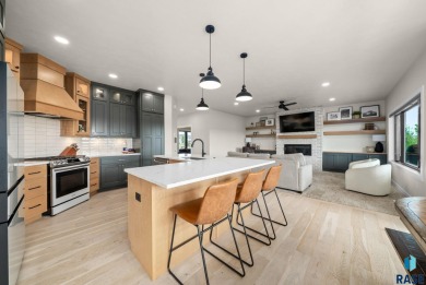 Experience luxury living in this beautiful two-story walkout on Willow Run Golf Course in South Dakota - for sale on GolfHomes.com, golf home, golf lot
