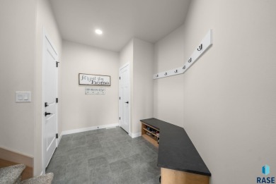 Experience luxury living in this beautiful two-story walkout on Willow Run Golf Course in South Dakota - for sale on GolfHomes.com, golf home, golf lot