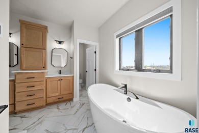 Experience luxury living in this beautiful two-story walkout on Willow Run Golf Course in South Dakota - for sale on GolfHomes.com, golf home, golf lot