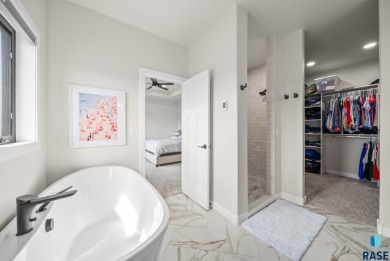 Experience luxury living in this beautiful two-story walkout on Willow Run Golf Course in South Dakota - for sale on GolfHomes.com, golf home, golf lot