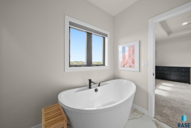 Experience luxury living in this beautiful two-story walkout on Willow Run Golf Course in South Dakota - for sale on GolfHomes.com, golf home, golf lot