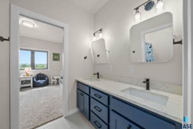 Experience luxury living in this beautiful two-story walkout on Willow Run Golf Course in South Dakota - for sale on GolfHomes.com, golf home, golf lot