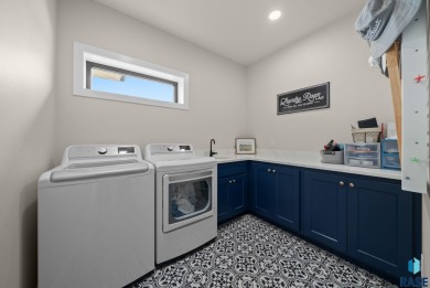 Experience luxury living in this beautiful two-story walkout on Willow Run Golf Course in South Dakota - for sale on GolfHomes.com, golf home, golf lot