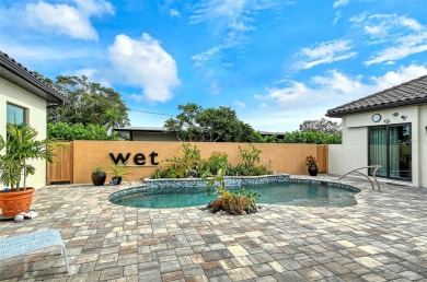 This custom-built island home represents Florida living at its on Lake Venice Golf Club in Florida - for sale on GolfHomes.com, golf home, golf lot