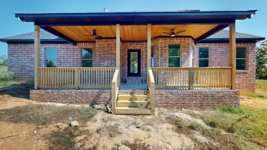 Located in an upscale cul-de-sac, this elegant home sits on a on Persimmon Ridge Golf Club in Arkansas - for sale on GolfHomes.com, golf home, golf lot